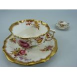 Dresden Spray's cup and saucer and a miniature Royal Crown Derby cup and saucer