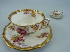 Dresden Spray's cup and saucer and a miniature Royal Crown Derby cup and saucer
