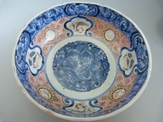 Two Chinese blue and white bowls - one large with Imari type colours internally, the other with