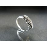 Either Platinum or unmarked white gold five diamond ring