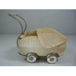 Vintage Wicker toy pram with metal wheels