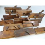 Selection of 12 antique Mahogany and other wooden moulding planes - most with original steel