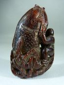 Chinese carved horn snuff bottle form as a man grasping a large carp appearing from lotus. - With