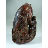 Chinese carved horn snuff bottle form as a man grasping a large carp appearing from lotus. - With