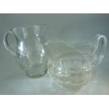 Antique clear glass jug along with a later glass jug with wheelcut decoration