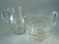 Antique clear glass jug along with a later glass jug with wheelcut decoration