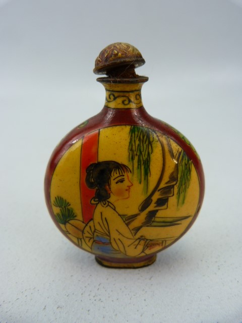 Unusual oriental snuff bottle of enamel over metal. The circular bodied bottle with two enamelled - Image 2 of 4