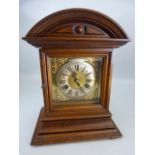 Oak dome topped mantle clock with bevel glass front