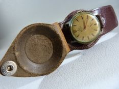 Vintage BALTIC Swiss made 15 Rubis watch on leather strap with leather face cover, the gold face