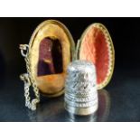 Hallmarked silver thimble by Charles Horner, Chester in original egg shaped box with finger chain