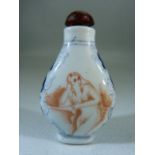 Chinese Porcelain snuff bottle in blue, white and Iron Red with Amber coloured stopper to top.