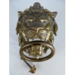 Large brass door knocker in the form of a lions head