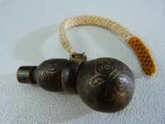 Oriental (possibly Japanese) powder flask formed of two metallic spheres and with fitted cap.