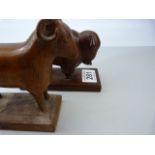 Two carved wooden African animals