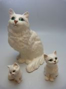 Beswick white cat with green eyes and her white green eyed kittens x 2