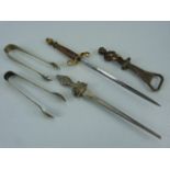 Two pairs of sugar nips (plate) two letter openers and a Belgium bottle opener