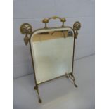 Art Nouveau brass framed fire screen with bevelled glass panel inset.