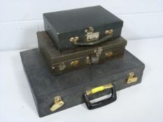 Three vintage vanity cases