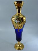 Late Victorian glass goblet in blue with Gilt Overlay and handpainted floral decoration. On a