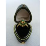 Ladies Gold coloured Emerald and Diamond cluster ring in heart shaped box
