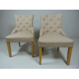 Pair of modern cream upholstered bedroom chairs