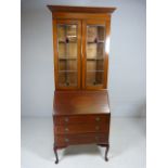 Mahogany Bureau Bookcase with fall front On Cabriole legs. The two door bookcase over with Art