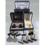 Eight pairs of modern cufflinks and a tie pin