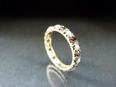 9ct hallmarked Eternity Ring set with ruby and pearls.