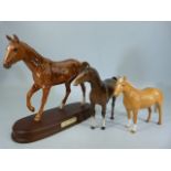 Royal Doulton 'My First Pony' on plinth along with two Beswick model horses