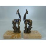 Pair of Art Deco stylised Deer on marble Plynths