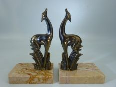 Pair of Art Deco stylised Deer on marble Plynths