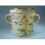 Unusual oriental lidded pot with bamboo moulded handles and handpainted with blossom and birds.