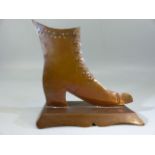 Copper Victorian shoe on stand