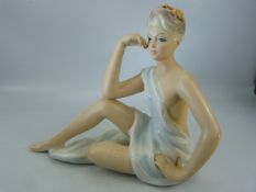 Ronzan figure of a scantily clad lady signed to base, made in Italy 1071, 31cm tall