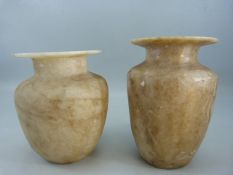 A Pair of Alabster Urns of cylindrical form and having translucent qualities. Sizes approx 17cm &