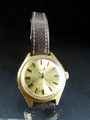 Tissot Actualis wristwatch with gold face and leather strap