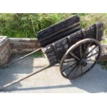 Antique stained wooden pony cart/Trap. Original wrought iron bound wheels.