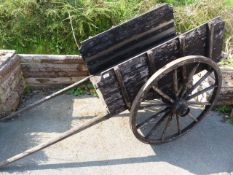Antique stained wooden pony cart/Trap. Original wrought iron bound wheels.