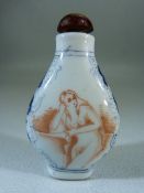 Chinese Porcelain snuff bottle in blue, white and Iron Red with Amber coloured stopper to top.