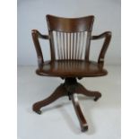 20th Century Arts and Crafts oak swivel chair.