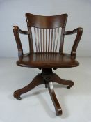 20th Century Arts and Crafts oak swivel chair.