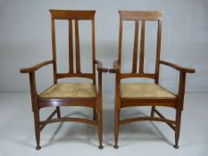 Arts and Crafts highback open arm oak carver chairs with upholstered seat