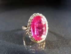 14ct hallmarked vintage ring set with a Synthetic Ruby surrounded by Diamonds.