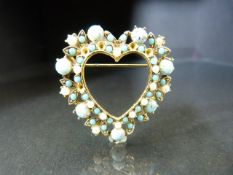 Victorian brooch in the form of a heart set with Turquoise.