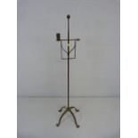 Antique iron candleabra on pad feet