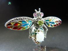 Silver and Plique - a - Jour brooch in the for of a bug with opal body