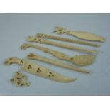 Inuit - Set of carved bone instruments/ tools all decorated with birds and Fish.
