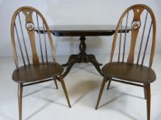 Ercol drop leaf dining table with two swan back chairs
