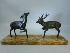 A figure group of Bronzed deer on marble plinth