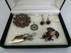 Set of three Norwegian and designer brooches along with a pendant and pair of earrings